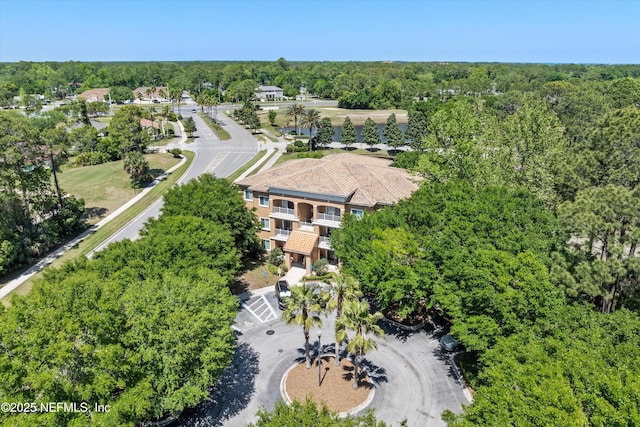 drone / aerial view with a view of trees