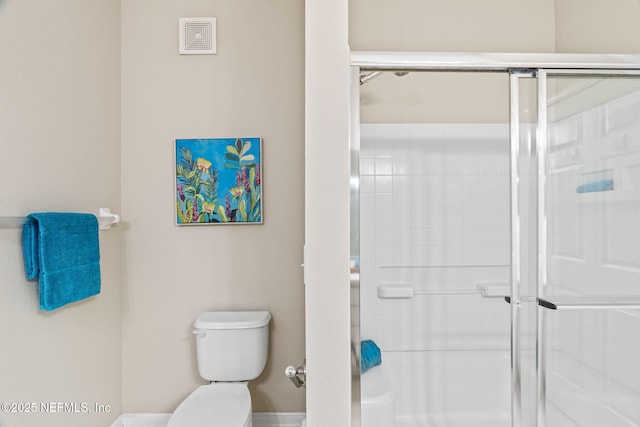 full bathroom with a stall shower, toilet, and visible vents