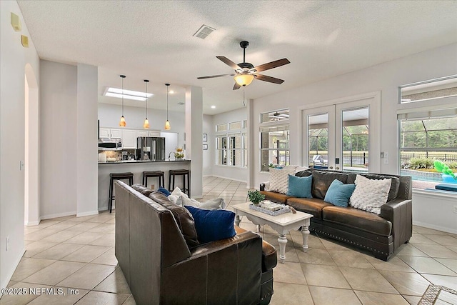 185 Edgewater Branch Dr, Saint Johns, FL 32259 - living area with baseboards, a ceiling fan, and light tile patterned flooring