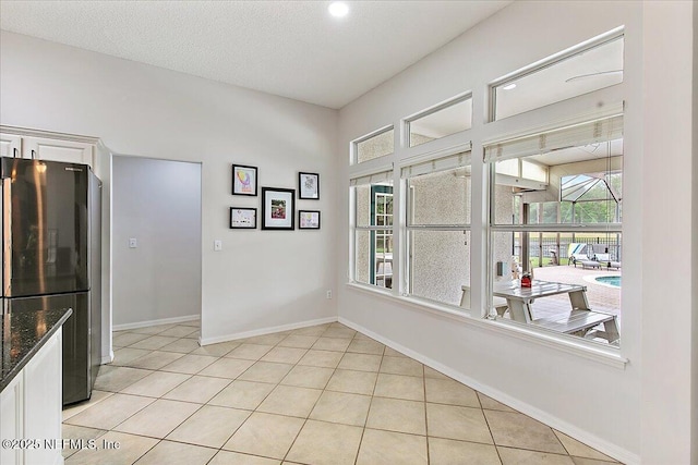 185 Edgewater Branch Dr, Saint Johns, FL 32259 - unfurnished dining area with baseboards, light tile patterned flooring, and a wealth of natural light