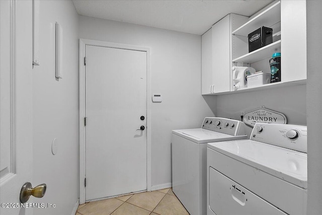 185 Edgewater Branch Dr, Saint Johns, FL 32259 - laundry area with cabinet space, light tile patterned flooring, baseboards, and washing machine and dryer