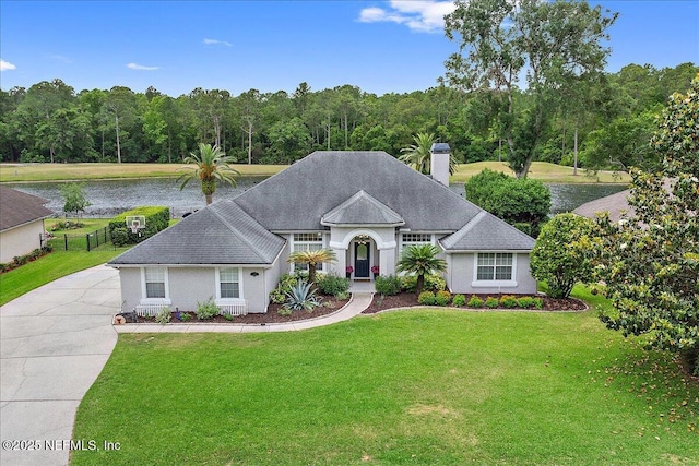 185 Edgewater Branch Dr, Saint Johns, FL 32259 - view of front of house featuring a water view, a chimney, and a front yard