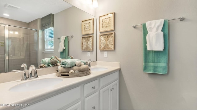 119 Craig Ct, Saint Johns, FL 32092 - bathroom featuring double vanity, visible vents, a shower stall, and a sink