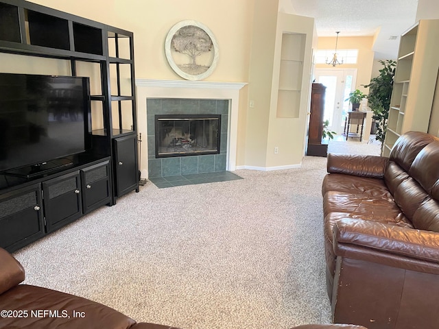 1831 Moss Creek Dr SW, Fleming Island, FL 32003 - carpeted living area with baseboards, a notable chandelier, and a tile fireplace