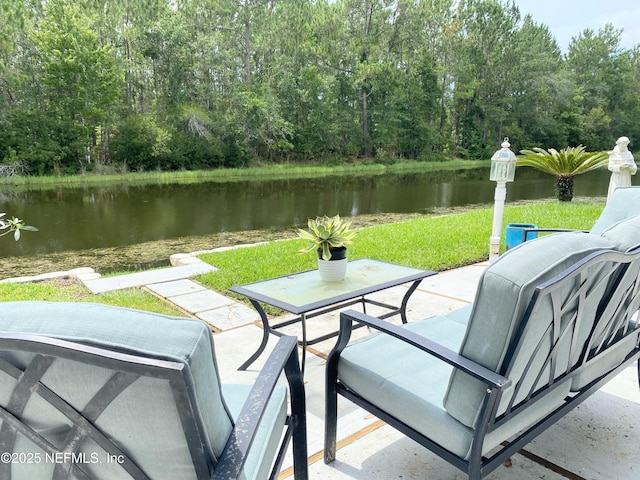 1831 Moss Creek Dr SW, Fleming Island, FL 32003 - view of patio / terrace featuring a water view and a wooded view
