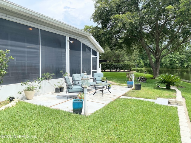1831 Moss Creek Dr SW, Fleming Island, FL 32003 - view of yard featuring a water view, a patio area, and a sunroom