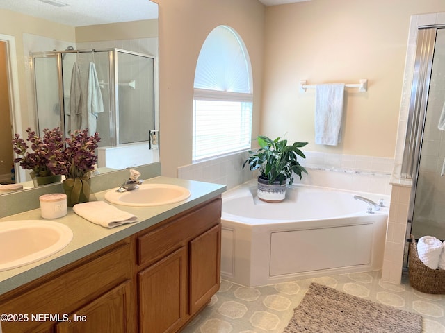 1831 Moss Creek Dr SW, Fleming Island, FL 32003 - bathroom featuring double vanity, a sink, a bath, and a shower stall