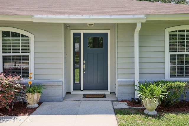 13198 Ebbtide Ct, Jacksonville, FL 32225 - property entrance featuring roof with shingles and covered porch