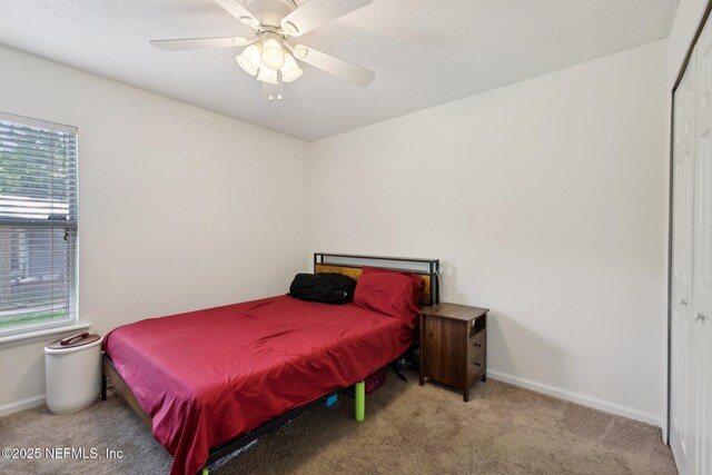 13198 Ebbtide Ct, Jacksonville, FL 32225 - carpeted bedroom featuring multiple windows, baseboards, a closet, and a ceiling fan