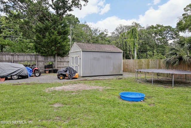 13198 Ebbtide Ct, Jacksonville, FL 32225 - view of yard featuring a trampoline, a shed, and an outdoor structure