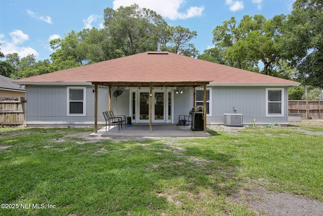 13198 Ebbtide Ct, Jacksonville, FL 32225 - rear view of house featuring central AC, a patio, and a shingled roof