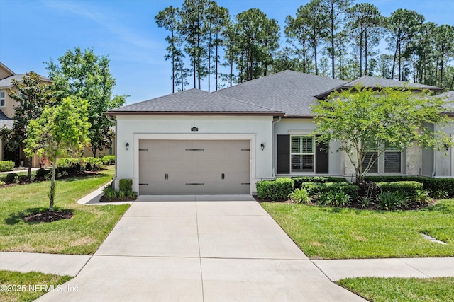 ranch-style house featuring an attached garage, stucco siding, a shingled roof, concrete driveway, and a front yard