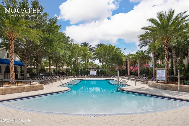 pool featuring a patio area