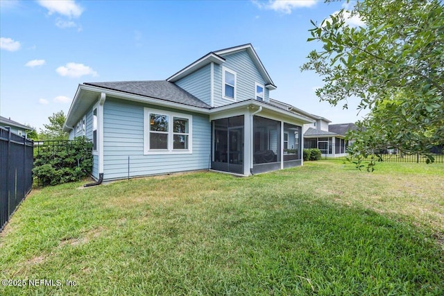 77 Palisade Dr, Saint Augustine, FL 32092 - rear view of house with fence, a yard, a shingled roof, and a sunroom