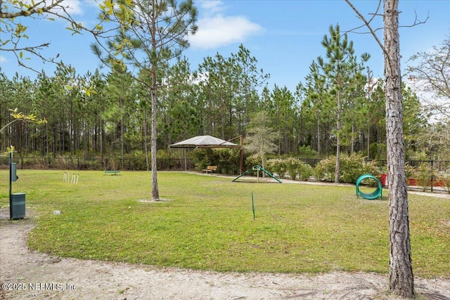 77 Palisade Dr, Saint Augustine, FL 32092 - surrounding community with a lawn, fence, and a carport