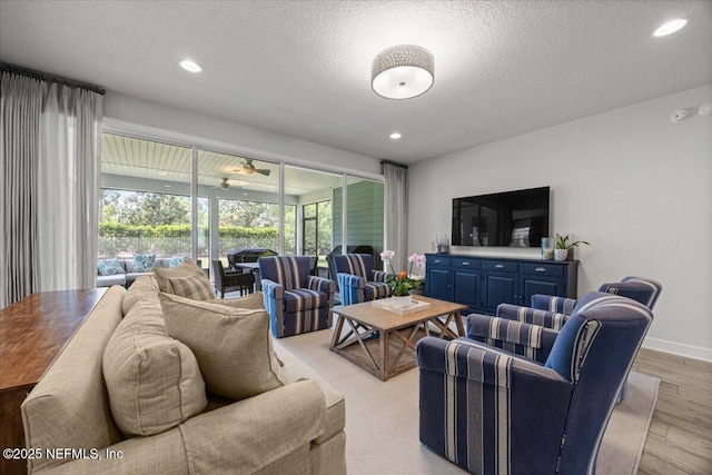 77 Palisade Dr, Saint Augustine, FL 32092 - living area with recessed lighting, a textured ceiling, light wood finished floors, and baseboards