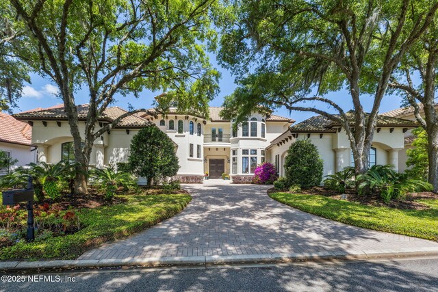 108 Harbourmaster Ct, Ponte Vedra Beach, FL 32082 - mediterranean / spanish-style house with stucco siding and decorative driveway