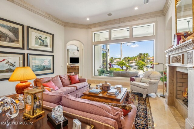 108 Harbourmaster Ct, Ponte Vedra Beach, FL 32082 - living area featuring a fireplace with flush hearth, arched walkways, and recessed lighting