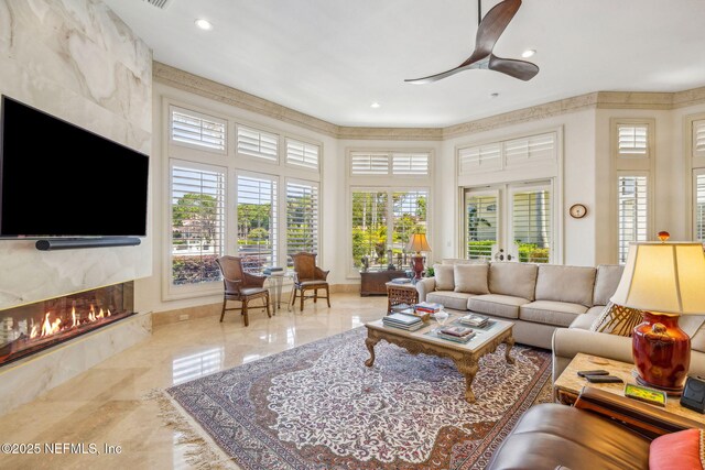 108 Harbourmaster Ct, Ponte Vedra Beach, FL 32082 - living area with a fireplace, marble tiled flooring, recessed lighting, and ceiling fan