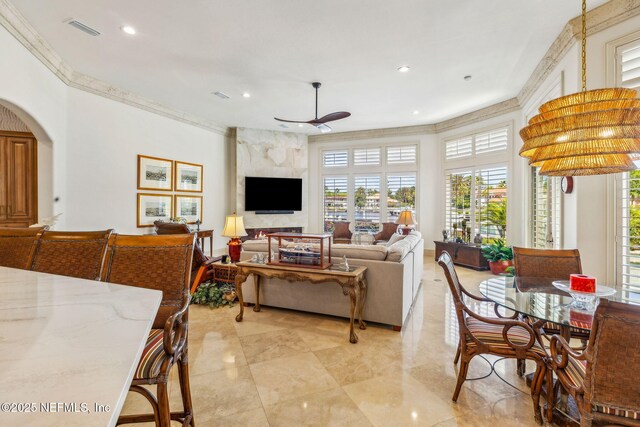 108 Harbourmaster Ct, Ponte Vedra Beach, FL 32082 - living room featuring ceiling fan, healthy amount of natural light, crown molding, recessed lighting, and arched walkways