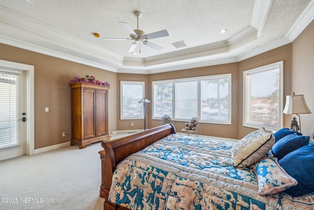 108 Harbourmaster Ct, Ponte Vedra Beach, FL 32082 - bedroom with crown molding, a tray ceiling, multiple windows, light colored carpet, and a textured ceiling