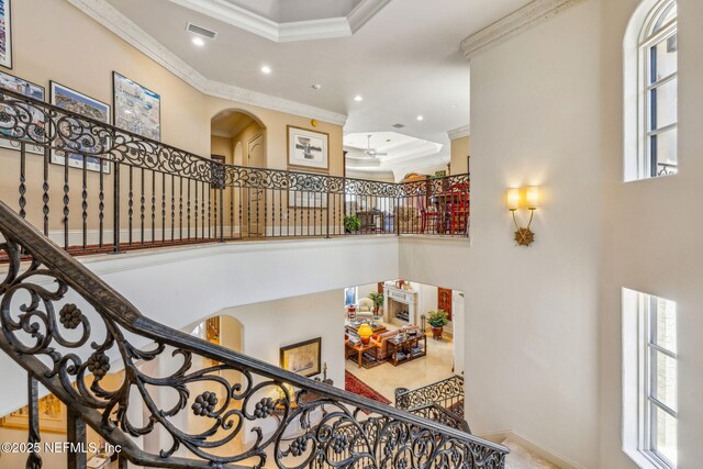108 Harbourmaster Ct, Ponte Vedra Beach, FL 32082 - staircase with arched walkways, ornamental molding, healthy amount of natural light, a towering ceiling, and recessed lighting