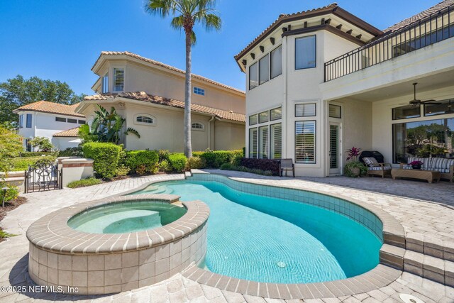108 Harbourmaster Ct, Ponte Vedra Beach, FL 32082 - view of pool featuring a pool with connected hot tub, a patio area, ceiling fan, and an outdoor living space