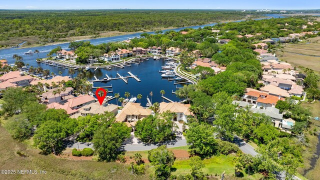 108 Harbourmaster Ct, Ponte Vedra Beach, FL 32082 - aerial view of residential area featuring numerous boat docks, a nearby body of water, and a forest