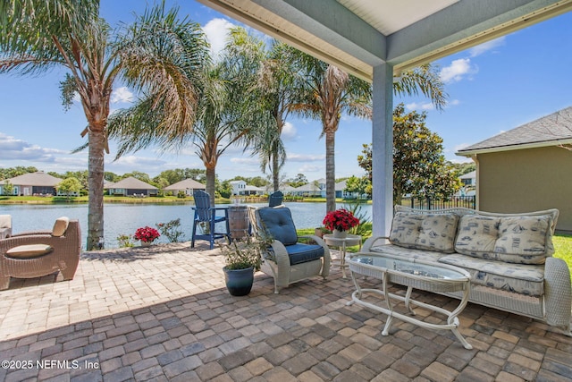 view of patio / terrace featuring a water view and outdoor lounge area