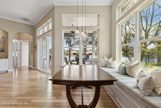 interior space with visible vents, arched walkways, and a healthy amount of sunlight