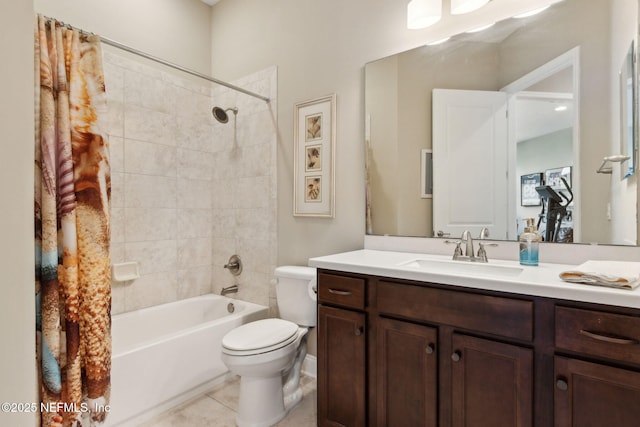 full bathroom with tile patterned floors, shower / bath combo with shower curtain, vanity, and toilet