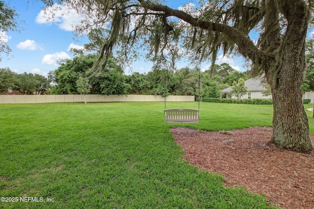 view of yard with fence