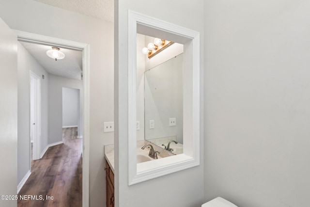 6085 Bermuda Dr, Fleming Island, FL 32003 - half bathroom featuring vanity and wood finished floors