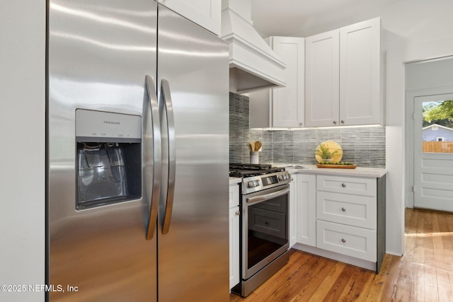 2930 Apache Ave, Jacksonville, FL 32210 - kitchen featuring stainless steel appliances, light countertops, and white cabinetry