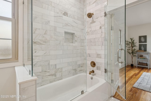 2930 Apache Ave, Jacksonville, FL 32210 - full bathroom with wood finished floors and enclosed tub / shower combo