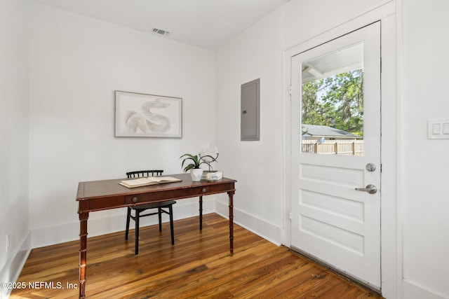2930 Apache Ave, Jacksonville, FL 32210 - doorway featuring wood finished floors, an office area, electric panel, and baseboards