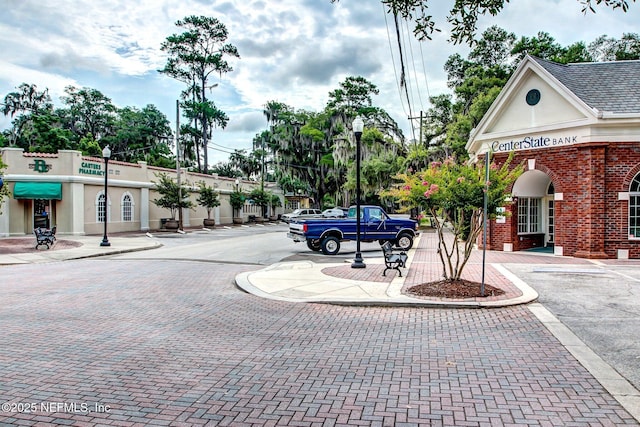 2930 Apache Ave, Jacksonville, FL 32210 - view of decorative road with street lights, sidewalks, and curbs
