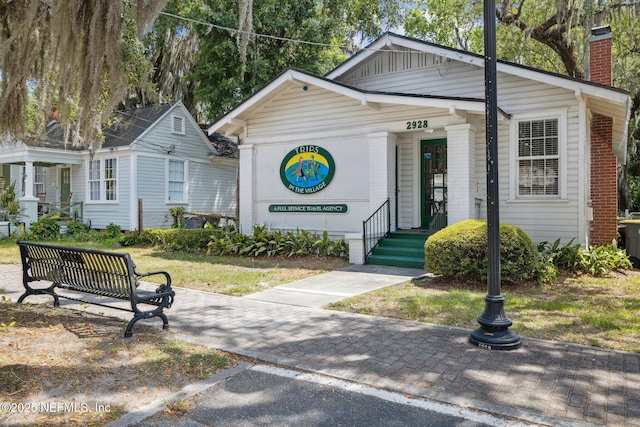 2930 Apache Ave, Jacksonville, FL 32210 - view of front of house featuring a chimney and brick siding