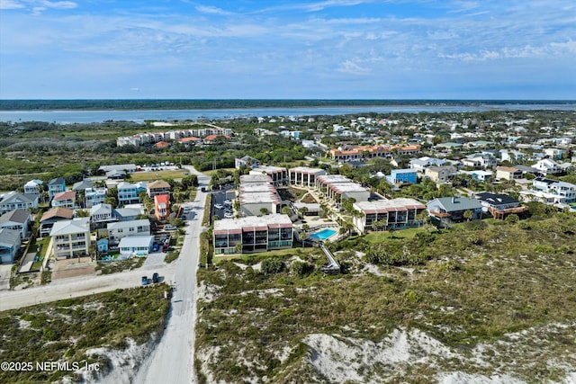 drone / aerial view with a water view and a residential view