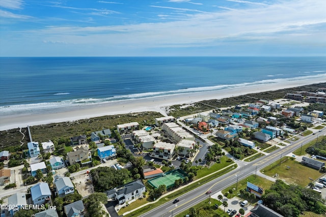 birds eye view of property with a beach view and a water view