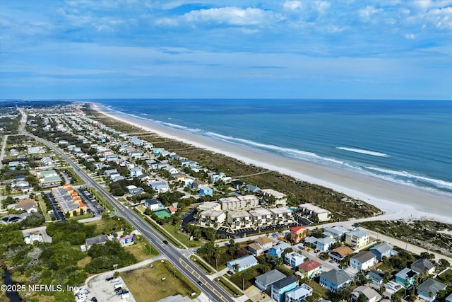 birds eye view of property with a water view, a view of the beach, and a residential view