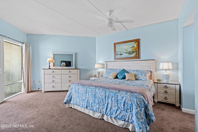 bedroom with baseboards, ceiling fan, carpet flooring, and a textured ceiling