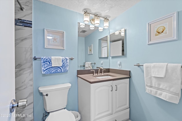 full bath with visible vents, a textured ceiling, toilet, and vanity