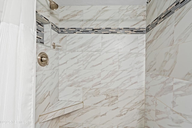 details featuring a tile shower