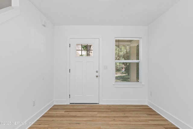 4220 Ribault River Ln, Jacksonville, FL 32209 - foyer featuring baseboards and light wood finished floors