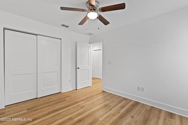 4220 Ribault River Ln, Jacksonville, FL 32209 - unfurnished bedroom with baseboards, a closet, light wood-type flooring, and visible vents