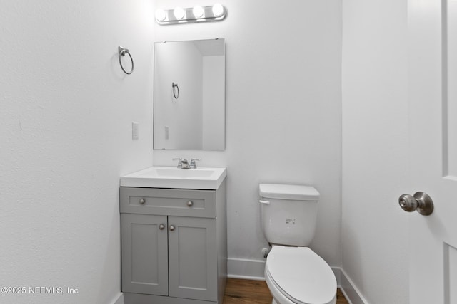 4220 Ribault River Ln, Jacksonville, FL 32209 - bathroom with baseboards, toilet, and vanity
