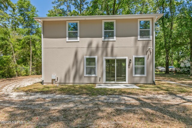 4220 Ribault River Ln, Jacksonville, FL 32209 - rear view of house with a patio area