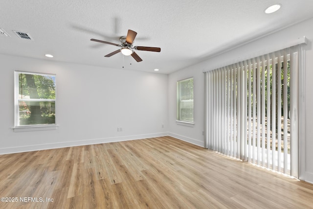4220 Ribault River Ln, Jacksonville, FL 32209 - empty room with visible vents, light wood-style floors, ceiling fan, and baseboards