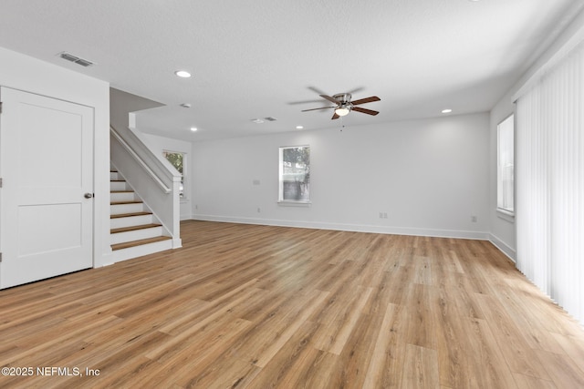 4220 Ribault River Ln, Jacksonville, FL 32209 - unfurnished living room with recessed lighting, a ceiling fan, stairs, and visible vents